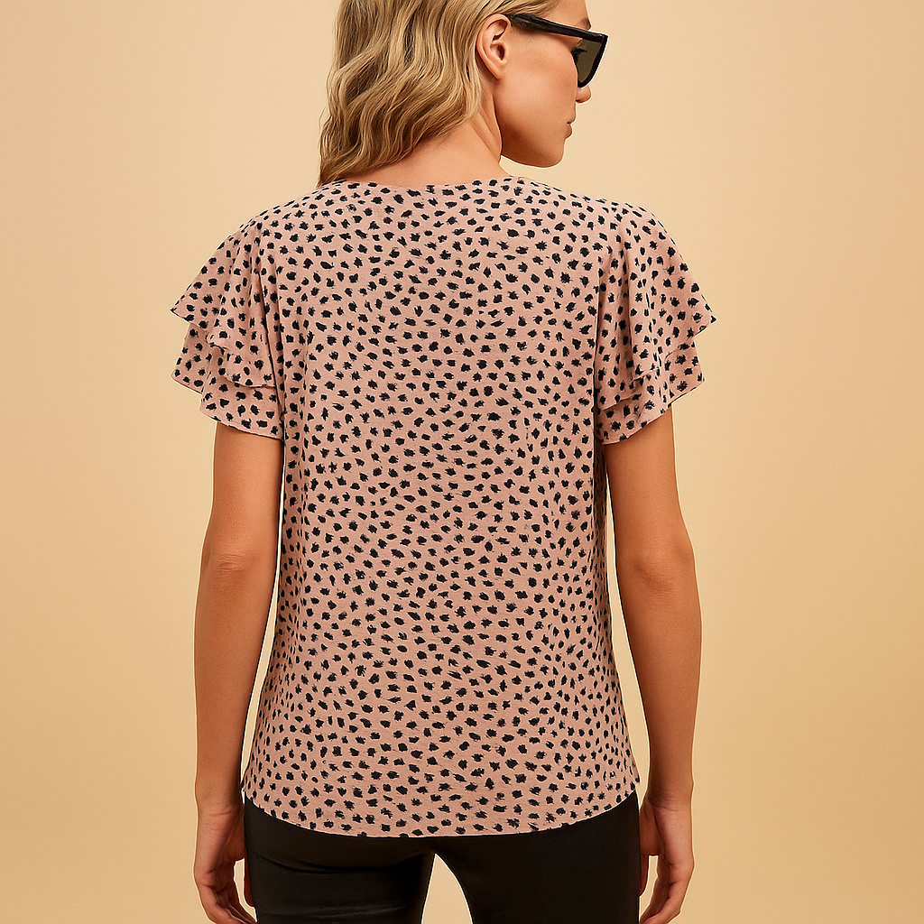 Women’s bold print flowy top with flattering fit and elegant design, perfect for casual wear and stylish occasions.