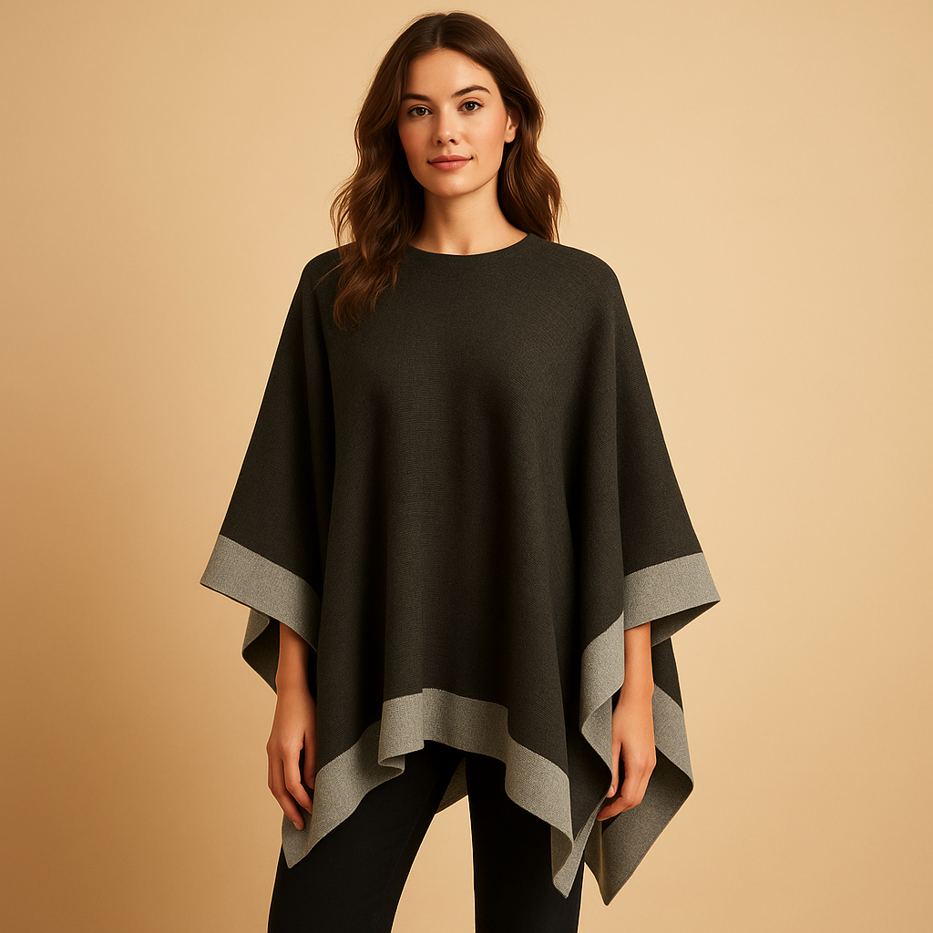 Women’s cashmere-style poncho with a flowing silhouette and open sides, designed for warm layered outfits in autumn and winter.