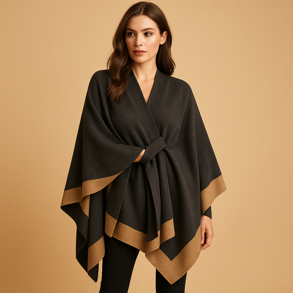 Women’s cashmere-style poncho with a flowing silhouette and open sides, designed for warm layered outfits in autumn and winter.