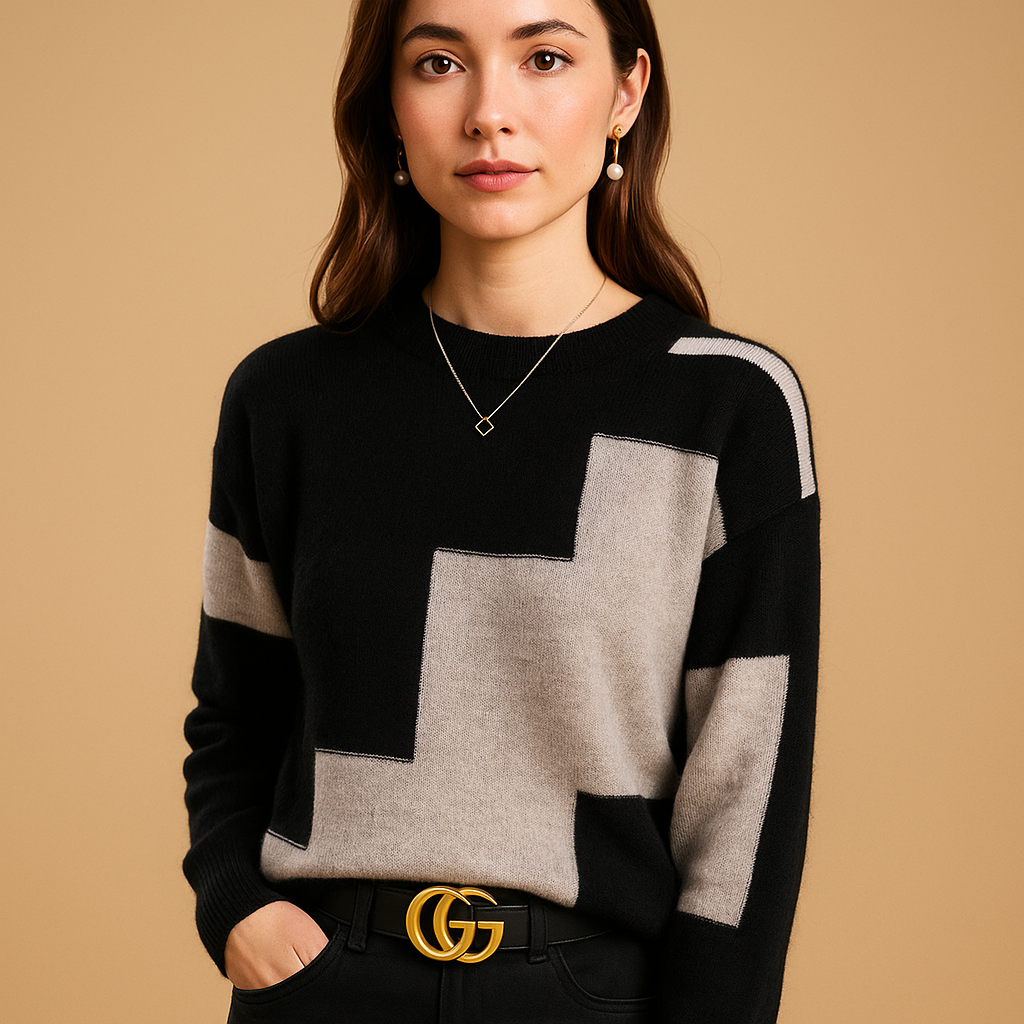 Women’s loose fit sweater with a minimalist design in neutral tones, featuring a soft breathable feel and flattering feminine silhouette.