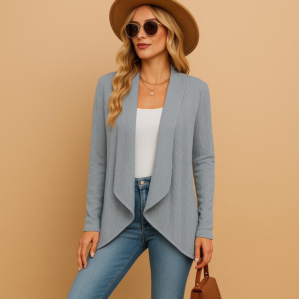 Long knitted cardigan for women in soft solid-colored knit with a relaxed fit, perfect for layering in autumn and spring outfits.