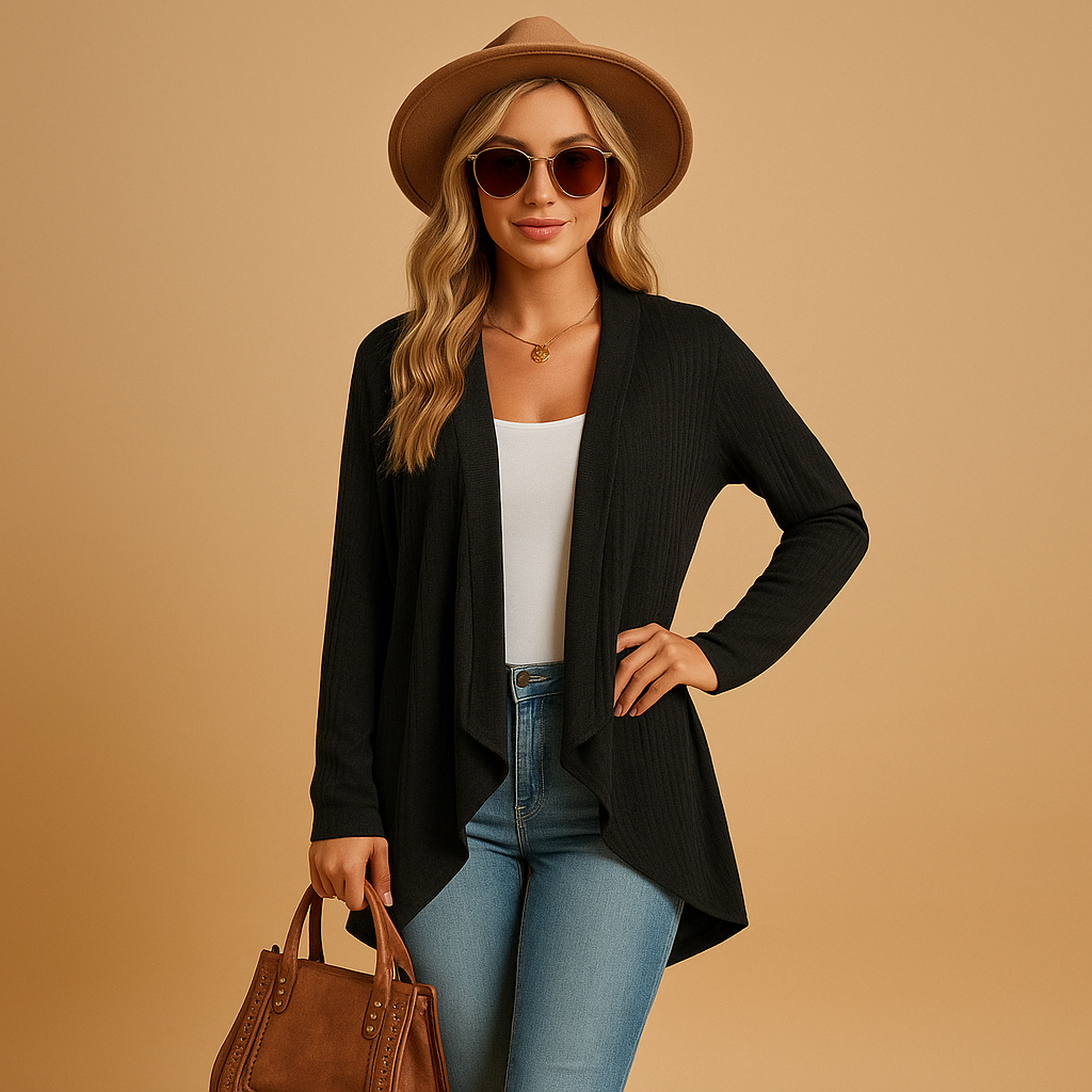 Long knitted cardigan for women in soft solid-colored knit with a relaxed fit, perfect for layering in autumn and spring outfits.