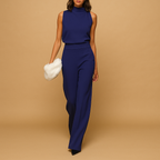 Women’s halter jumpsuit with wide legs, high waist, and bow detail – perfect for parties, dinners, and stylish seasonal outings.