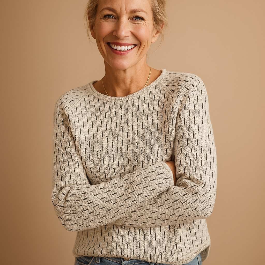 Women’s elegant knitted winter sweater in breathable grey fabric with relaxed fit, perfect for layering and versatile winter styling.