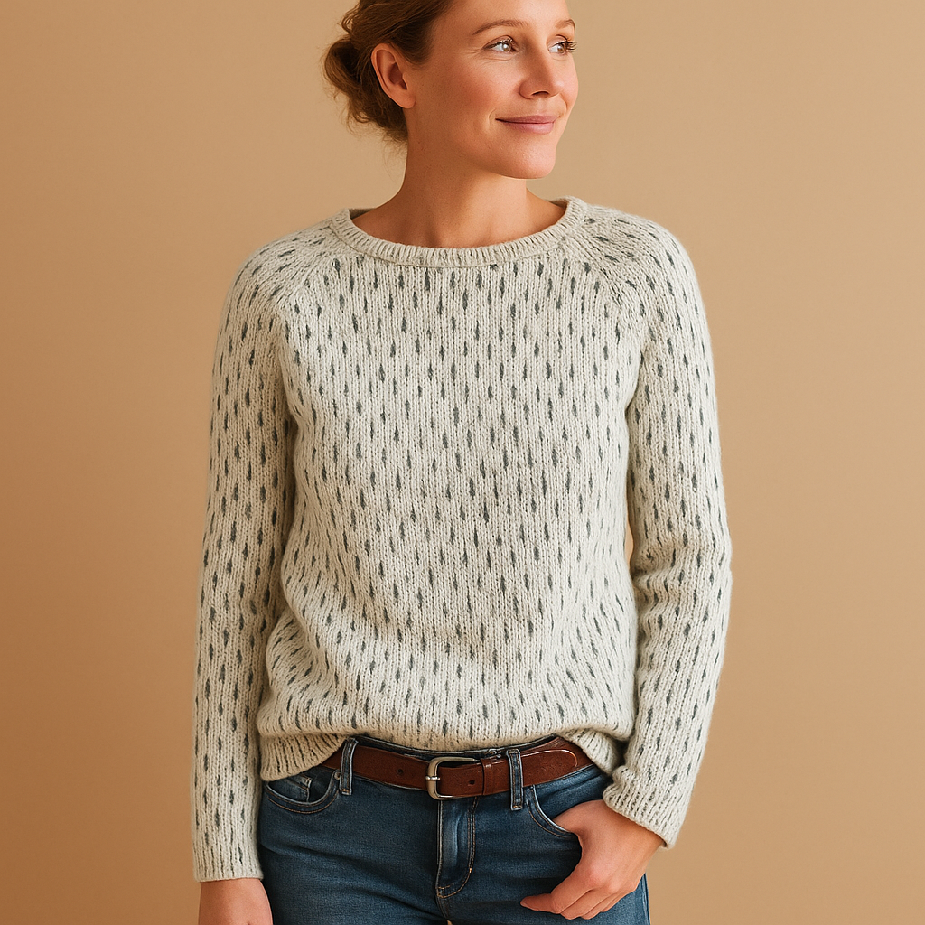 Women’s elegant knitted winter sweater in breathable grey fabric with relaxed fit, perfect for layering and versatile winter styling.