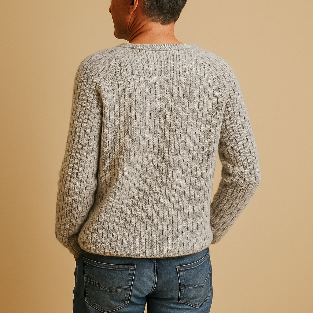 Women’s elegant knitted winter sweater in breathable grey fabric with relaxed fit, perfect for layering and versatile winter styling.