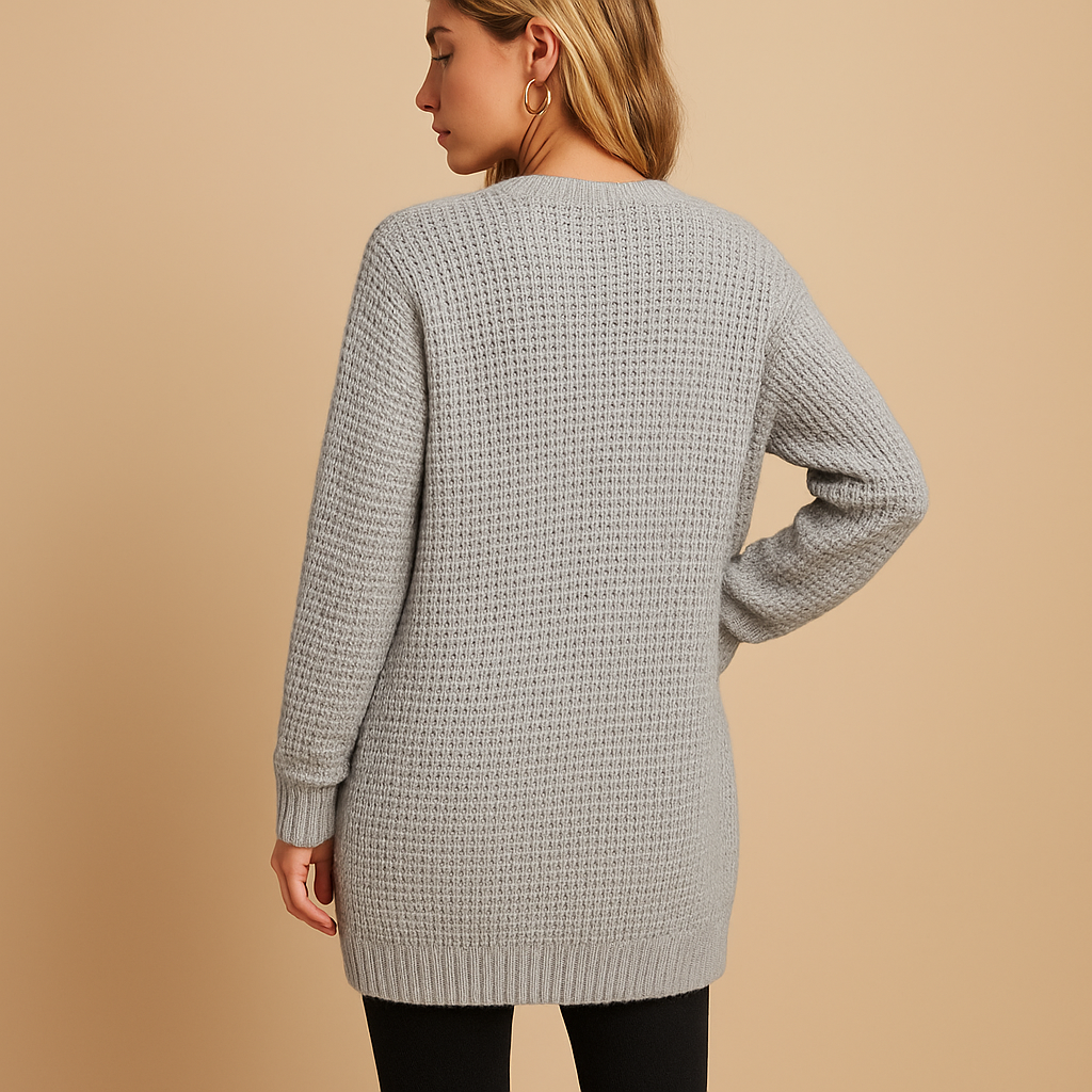 Women’s long cardigan with v-neck, relaxed fit, and practical pockets. Made from soft breathable fabric, ideal for autumn, winter, or casual everyday wear.