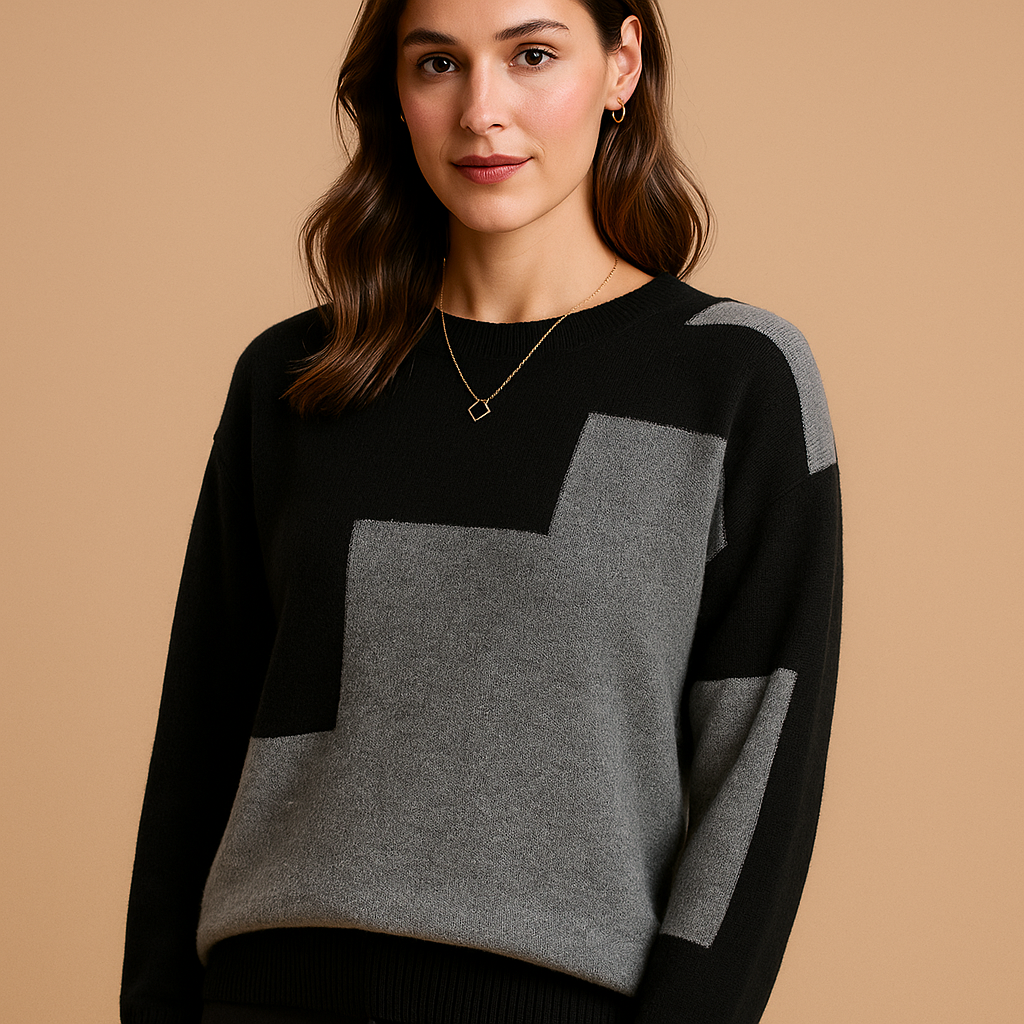 Women’s loose fit sweater with a minimalist design in neutral tones, featuring a soft breathable feel and flattering feminine silhouette.