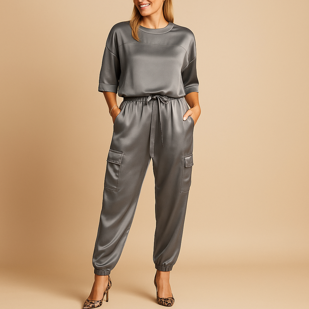 Satin two-piece set for women with half-sleeve top and straight-leg pants, ideal for elegant occasions or luxurious loungewear.