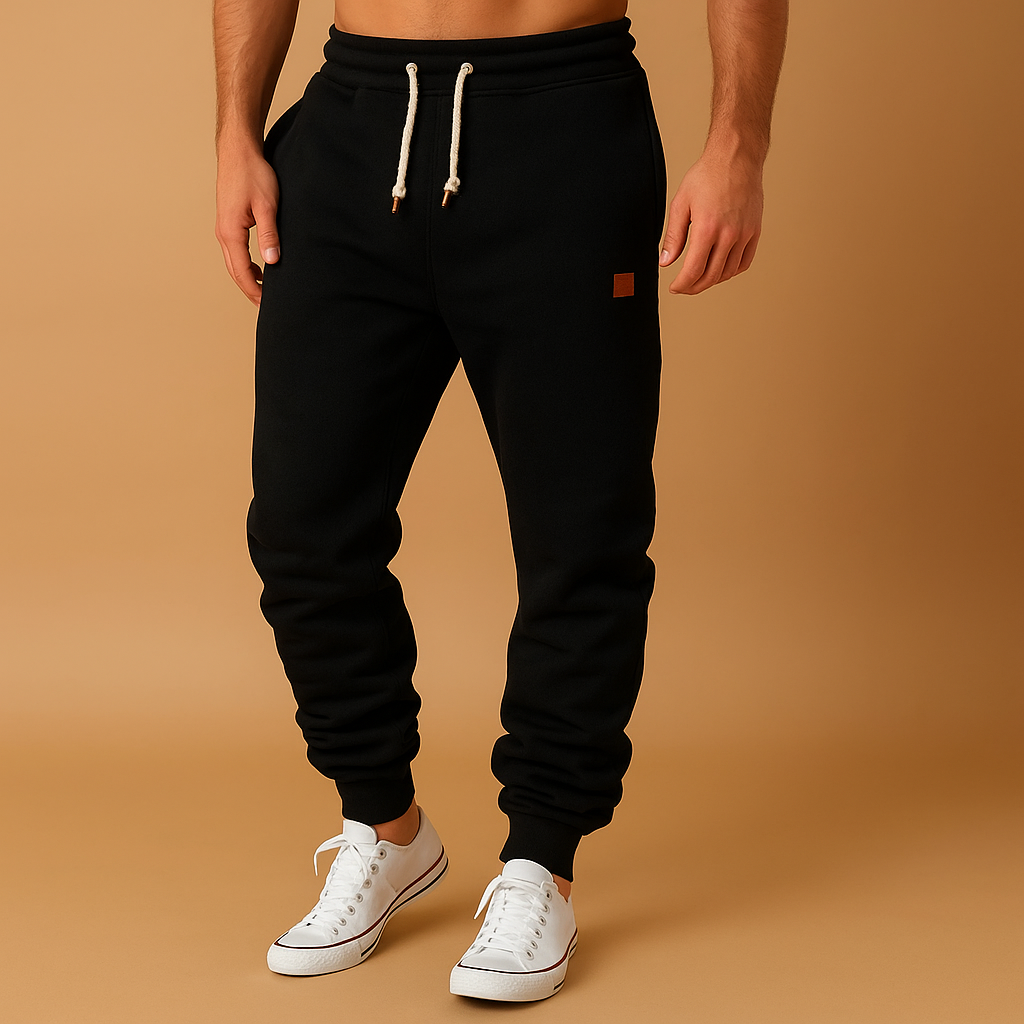 Men’s stylish jogger pants made from soft cotton blend with adjustable waistband and side pockets, ideal for workouts or casual wear.