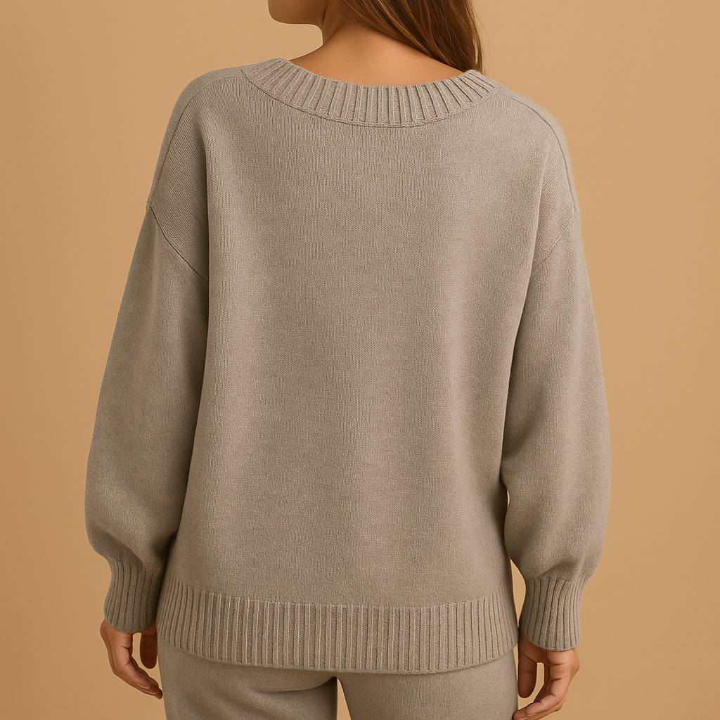 Women’s V-neck knit sweater in neutral tones with slim, comfortable fit. Perfect for office wear, layering, or casual everyday outfits.