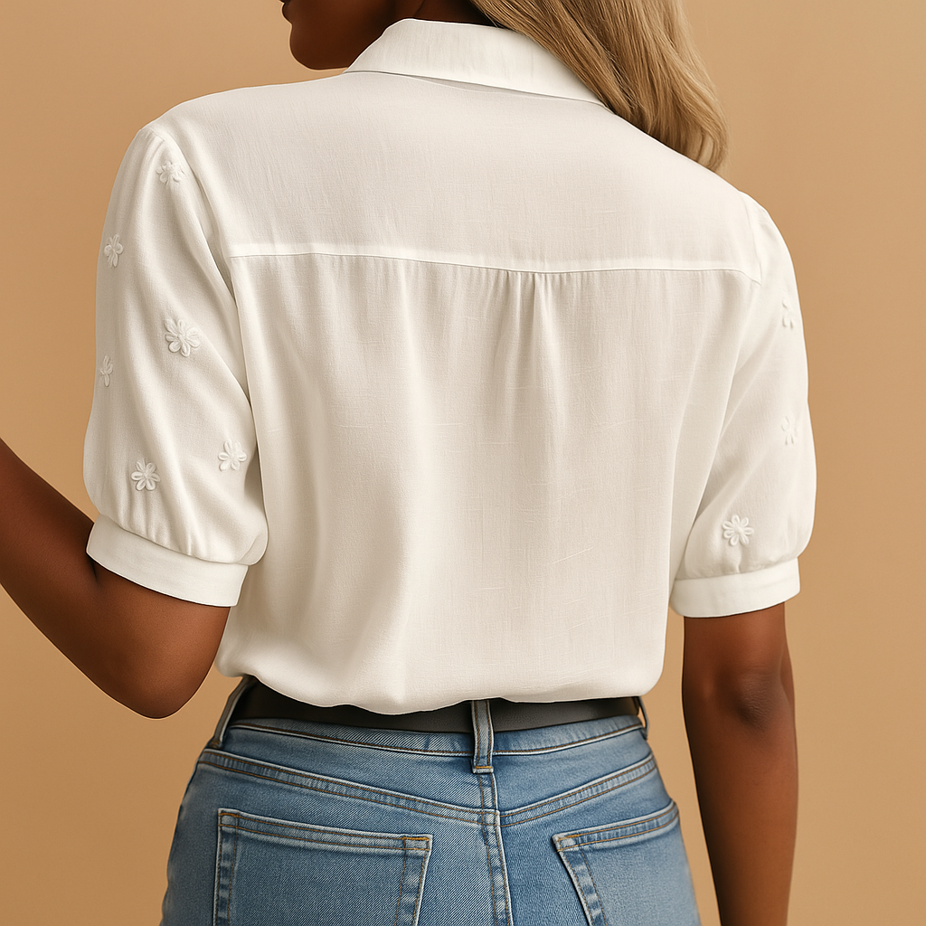 White elegant blouse for women with a classic collar and button-down front, ideal for work or casual outfits.